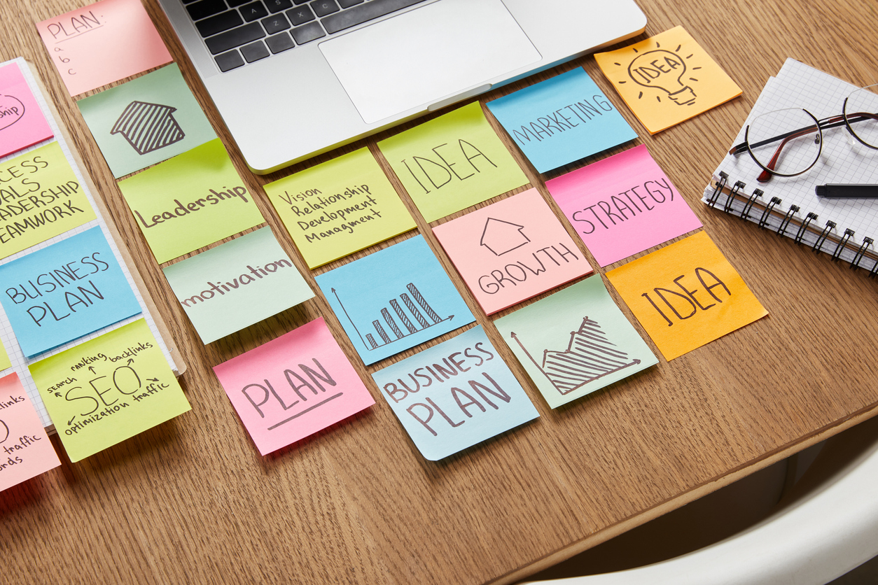 computer desk with post-it notes