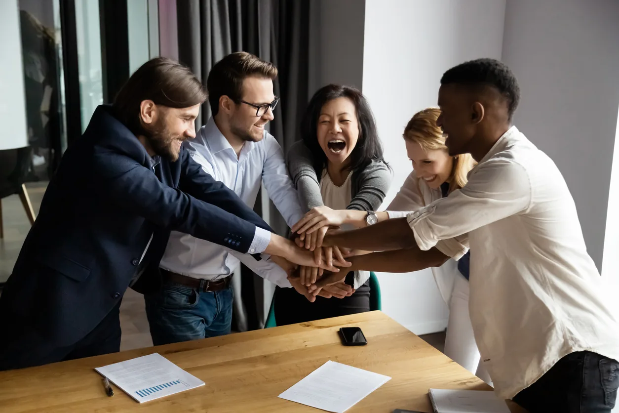 team with hands in